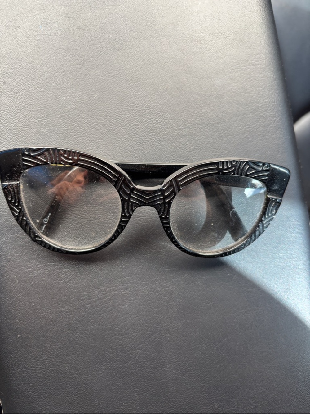 Black Textured Cat-Eye Women's prescription glasses, selling them for the frame